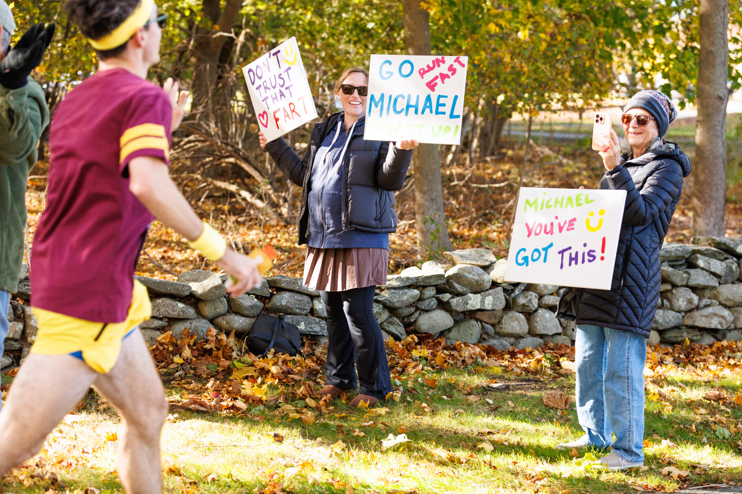 Friends and family cheering on their runner at the Colt State Park Half Marathon.