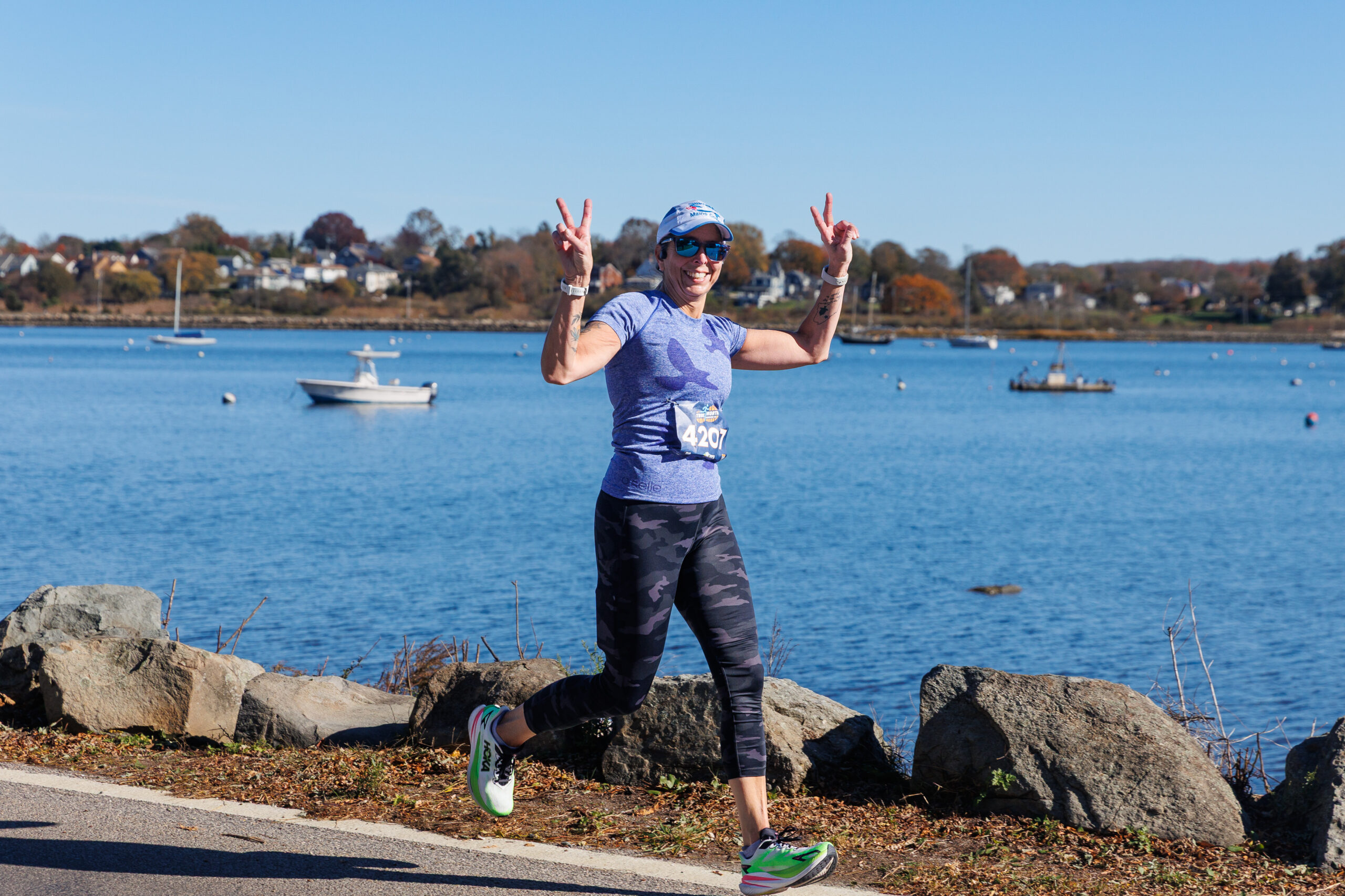 Runner on Bristol Harbor during Colt State Park Half Marathon.